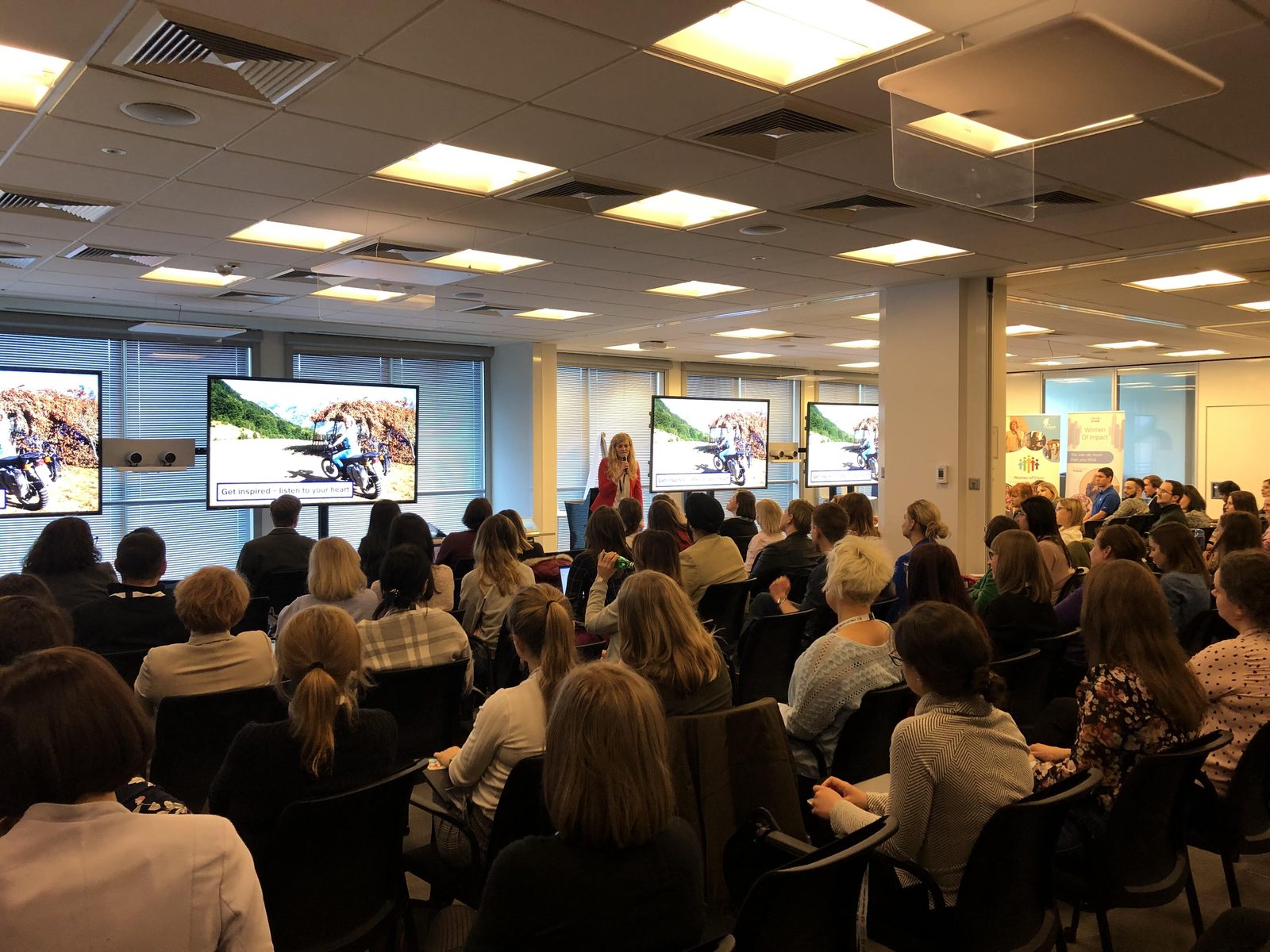 Jagoda Pasko presenting to a full room at a Women of Impact event