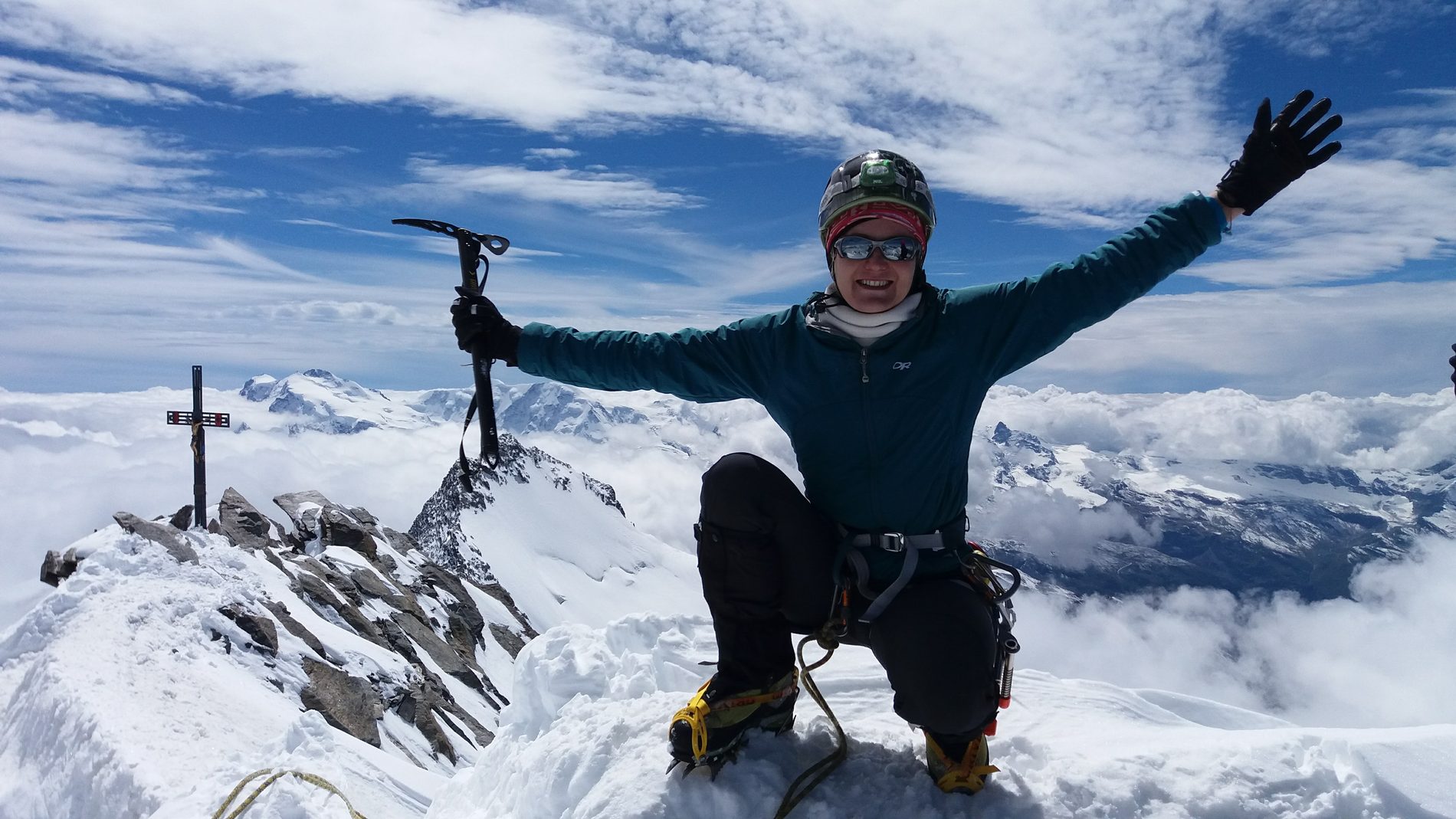 Jagoda Pasko on a snow-covered summit above the clouds
